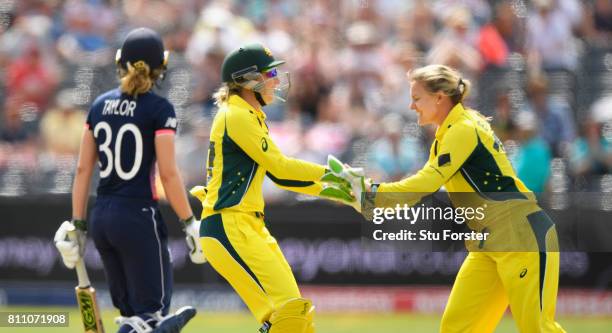 Australia bowler Kristen Beams is congratulated by Healy after bowling Sarah Taylor during the ICC Women's World Cup 2017 match between England and...