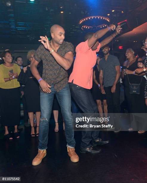 Professional basketball player Gerald Henderson Jr. And former professional basketball player Gerald Henderson Sr. Dance in a "Soul Train line"...