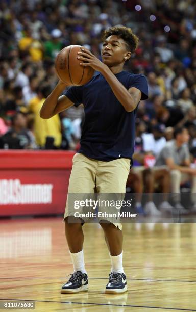 Koraun Mayweather, son of boxer Floyd Mayweather Jr., shoots baskets as part of a promotion during a timeout in a 2017 Summer League game between the...