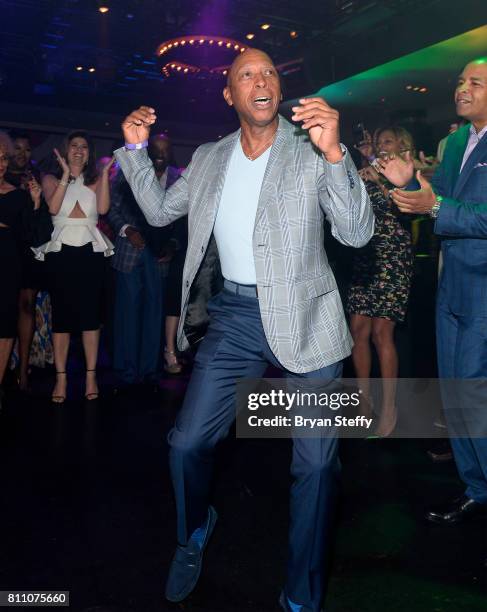 Recording artist Jeffery Osborne dances in a "Soul Train line" during the Coach Woodson Las Vegas Invitational red carpet and pairings gala at 1 OAK...