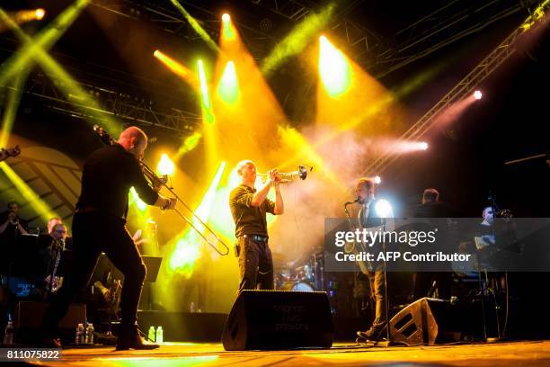 Bertrand Luzignant, Vincent Payen and Thomas Faure of French band Electro Deluxe perform during the 24th edition of the Cognac Blues festival in...