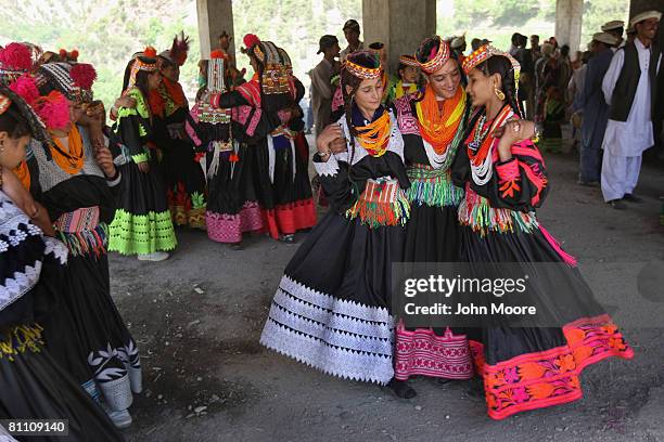 Girls from the polytheistic Kalash tribe dance at the Joshi spring festival May 15, 2008 in the remote Chitral village of Rumbur in northwestern...