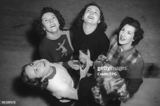 Skaters from the 'Babes in the Wood on Ice' show at the Empress Hall in London perform their twice-daily gargle in an attempt to avoid the 'flu, 11th...