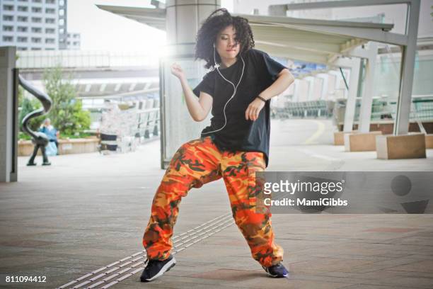asian beautiful dancer dancing street - hip hop stockfoto's en -beelden