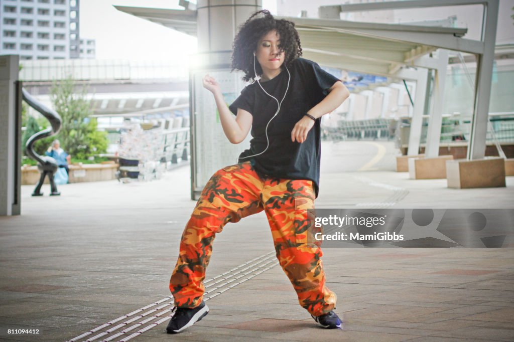 Asian beautiful dancer dancing street