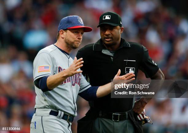 Manager Andy Green of the San Diego Padres argues with home plate umpire Alan Porter after an infield single by Bradley Zimmer of the Cleveland...