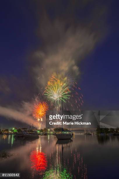 fourth of july local fireworks over mamaroneck harbor, new york - mamaroneck stock pictures, royalty-free photos & images