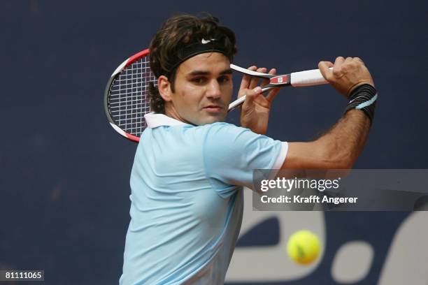 Roger Federer of Switzerland returns during the match against Fernando Verdasco of Spain during day five of the Tennis Masters Series Hamburg at...