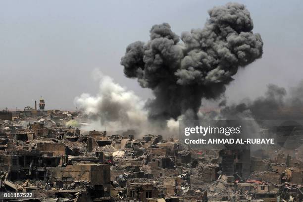 Picture taken on July 9 shows smoke billowing following an airstrike by US-led international coalition forces targeting Islamic State group in Mosul....