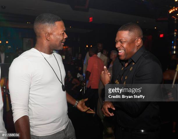 Actors/comedians Flex Alexander and Chris Tucker attend the Coach Woodson Las Vegas Invitational red carpet and pairings gala at 1 OAK Nightclub at...