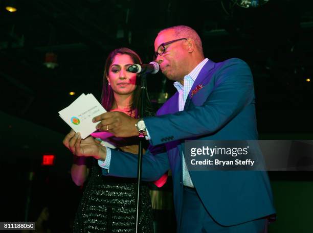 Host and professional golfer Seema Sedekar and host and ESPN announcer Jay Harris speak during the Coach Woodson Las Vegas Invitational red carpet...