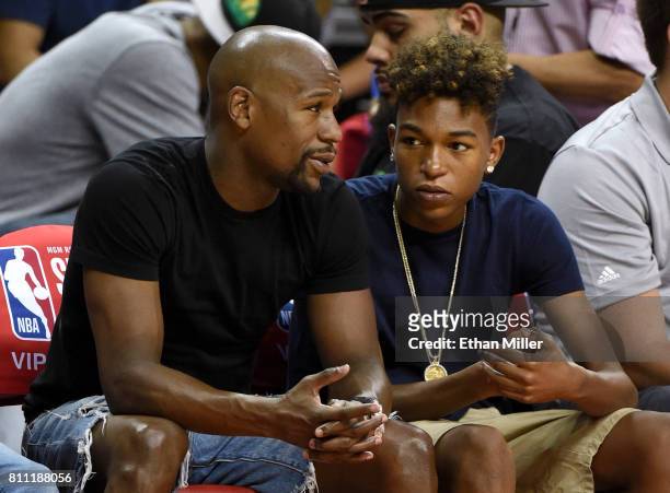 Boxer Floyd Mayweather Jr. And his son Koraun Mayweather attend a 2017 Summer League game between the Boston Celtics and the Los Angeles Lakers at...