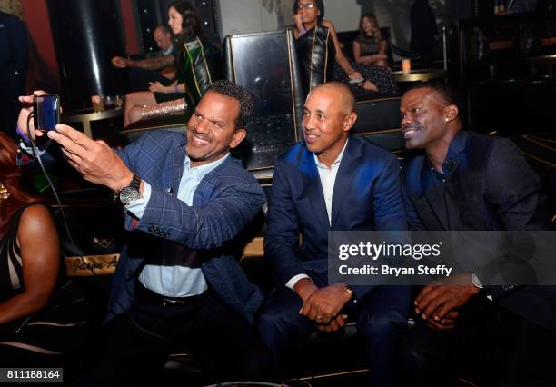 Hall of Fame Member Andre Reed, former professional basketball player John Starks and Vincent Lewis attend the Coach Woodson Las Vegas Invitational...