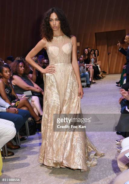 Model dressed by Sublim Elle walks the runway during the "Paris Appreciation Awards 2017" At The Eiffel Tower on July 8, 2017 in Paris, France.