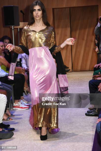 Model dressed by Amal Sultana Khan walks the runway during the "Paris Appreciation Awards 2017" At The Eiffel Tower on July 8, 2017 in Paris, France.