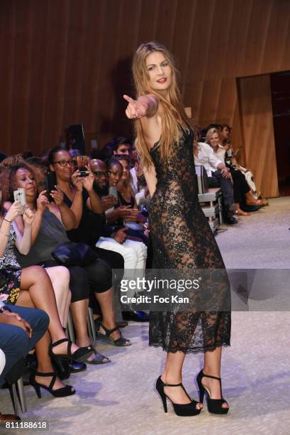 Model dressed by Verone Creatrice walks the runway during the "Paris Appreciation Awards 2017" At The Eiffel Tower on July 8, 2017 in Paris, France.