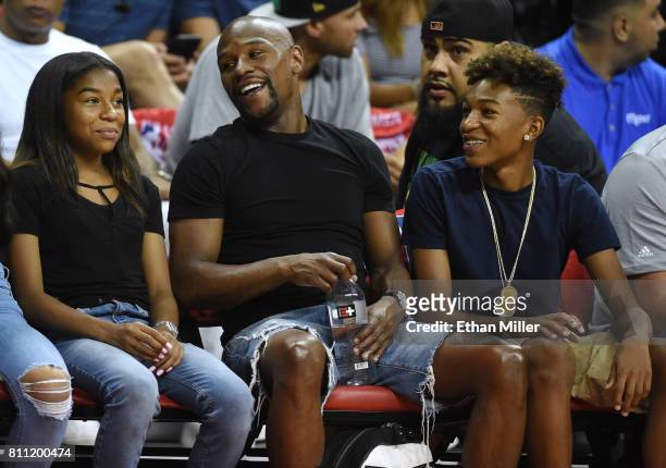 Boxer Floyd Mayweather Jr. , his daughter Jirah Mayweather and his son Koraun Mayweather attend a 2017 Summer League game between the Boston Celtics...