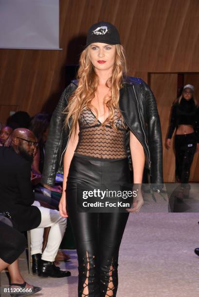 Model dressed by Morsure walks the runway during the "Paris Appreciation Awards 2017" At The Eiffel Tower on July 8, 2017 in Paris, France.