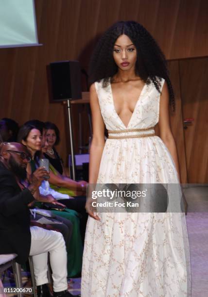Model dressed by Dimitry Vincent for Hello Diit walks the runway during the "Paris Appreciation Awards 2017" At The Eiffel Tower on July 8, 2017 in...