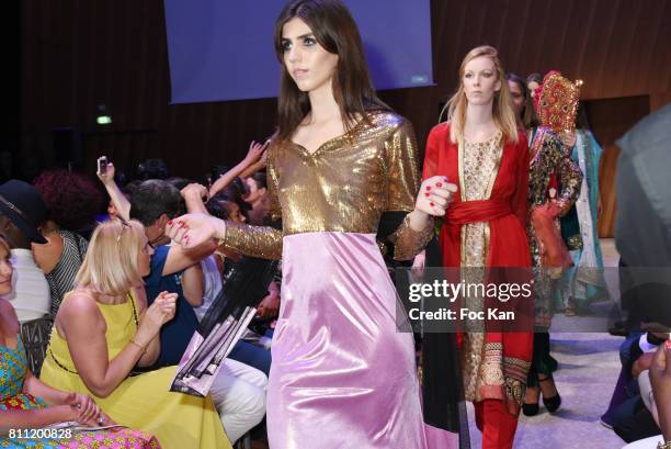 Models dressed by Amal Sultana Khan walk the runway during the "Paris Appreciation Awards 2017" At The Eiffel Tower on July 8, 2017 in Paris, France.