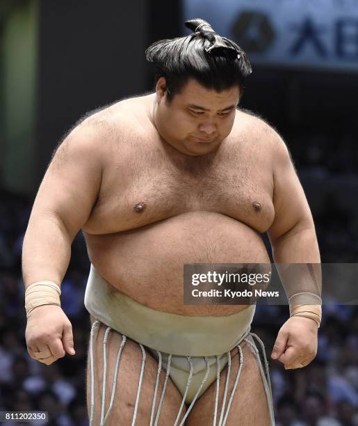 Takayasu, promoted to sumo's second-highest rank ozeki after the last tourney in May, looks down after losing to No. 2 maegashira Hokutofuji on the...