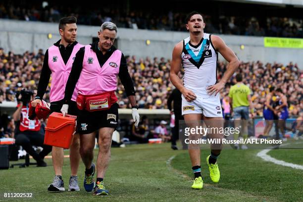 Sam Powell-Pepper of the Power leaves the field injured during the round 16 AFL match between the West Coast Eagles and the Port Adelaide Power at...