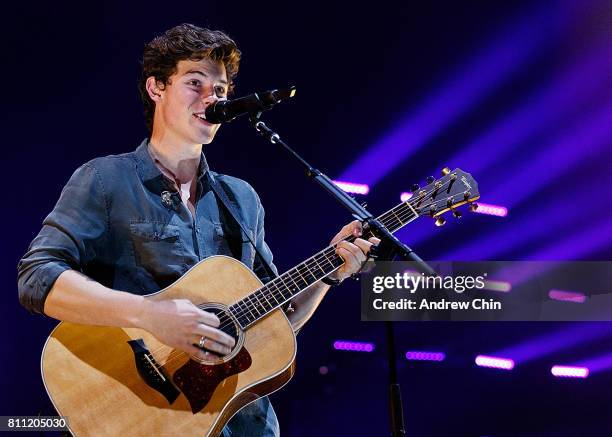 Canadian singer-songwriter Shawn Mendes performs on stage during his 'Illuminate World Tour' at Rogers Arena on July 8, 2017 in Vancouver, Canada.