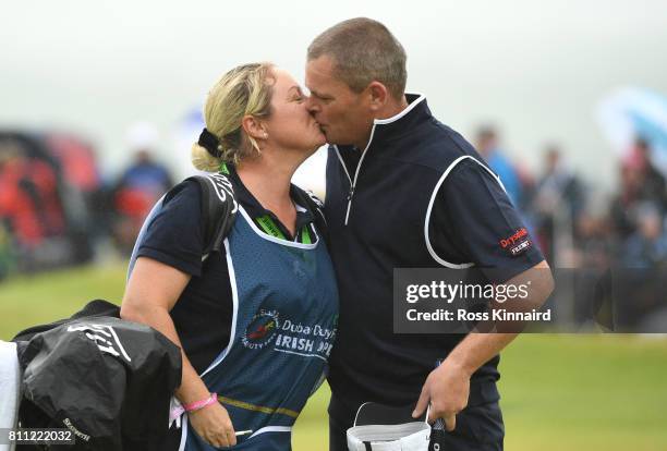 David Drysdale of Scotland completes his round on the 18th green with wife / caddie Vicky during the final round of the Dubai Duty Free Irish Open at...
