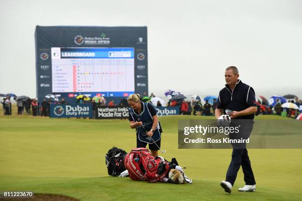 David Drysdale of Scotland walks off the 18th green with wife / caddie Vicky during the final round of the Dubai Duty Free Irish Open at Portstewart...