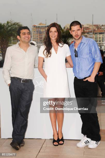 Actors Laurent Capelluto, Chiara Mastroianni and Melvil Poupaud attend the Un Conte de Noel photocall at the Palais des Festivals during the 61st...