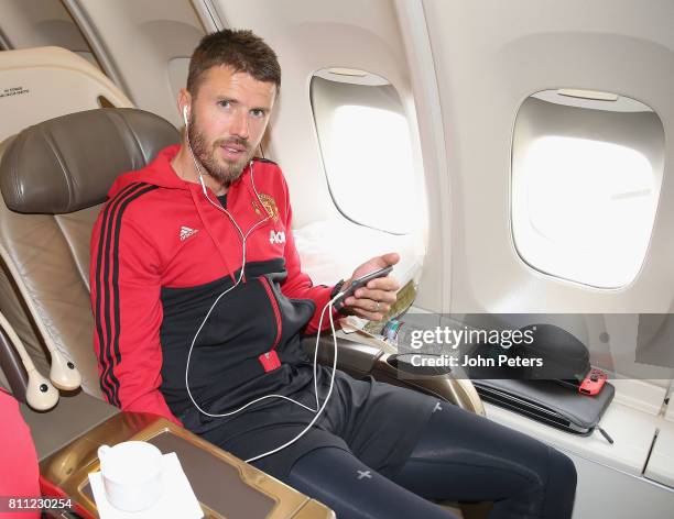 Michael Carrick of Manchester United sits on the aeroplane ahead of the club's pre-season tour of the USA at Manchester Airport on July 9, 2017 in...