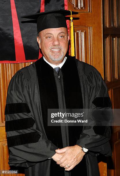 Artist Billy Joel poses before receiving an honorary Doctorates from the Manhattan School of Music at the Riverside Church in Harlem on May 16, 2008...