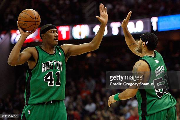 James Posey and Eddie House of the Boston Celtics celebrate a play against the Cleveland Cavaliers in Game Six of the Eastern Conference Semifinals...