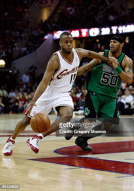 Damon Jones of the Cleveland Cavaliers drives against Eddie House of the Boston Celtics in Game Six of the Eastern Conference Semifinals during the...