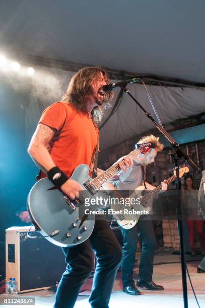 Dave Grohl and Nate Mendel of Foo Fighters performing at Stubb's at the opening of their documentary, 'Foo Fighters: Back and Forth,' at the South by...