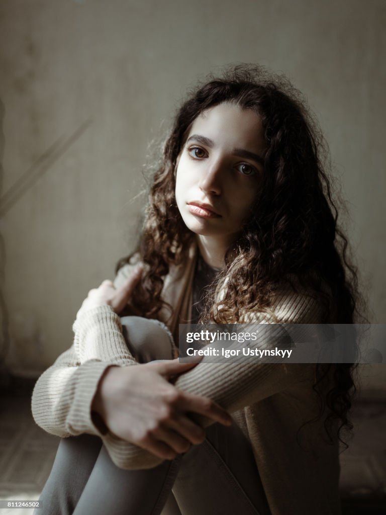 Portrait of woman in old apartment