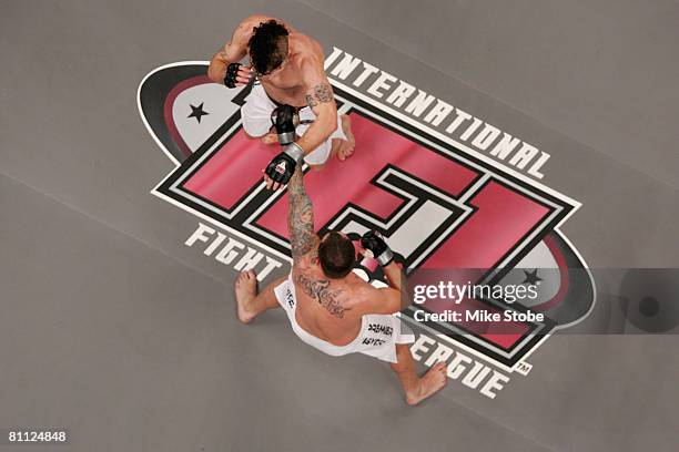 Joey Guel receives a punch from Matt Horwich of the Team Quest Fight club during their bout presented by the International Fighting League at the...