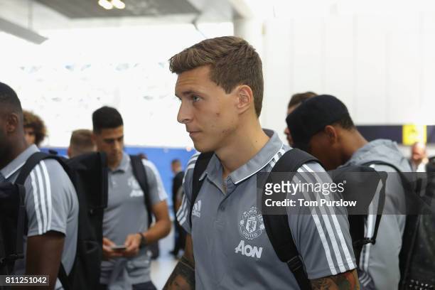 Victor Lindelof of Manchester United checks in at Manchester Airport ahead of the club's pre-season tour of the USA at Manchester Airport on July 9,...