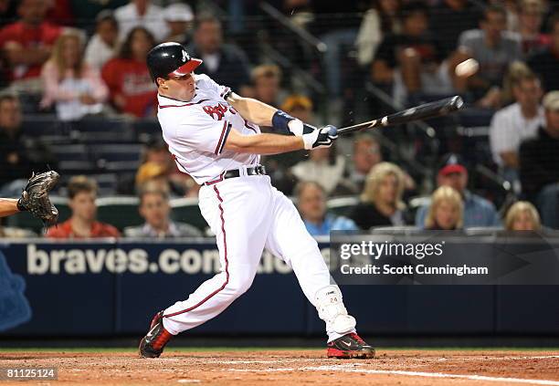 Mark Teixeira of the Atlanta Braves breaks his bat while hitting against the Oakland Athletics at Turner Field on May 16, 2008 in Atlanta, Georgia....