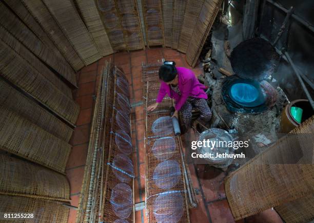 woman make girdle cake (banh trang) - is the usual rice flour's cake of viet nam - women in girdles stock pictures, royalty-free photos & images