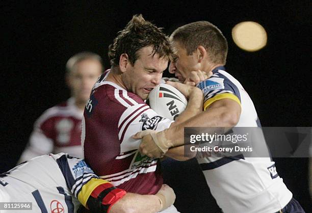 Josh Perry of the Sea Eagles is tackled during the round 10 NRL match between the Manly Warringah Sea Eagles and the North Queensland Cowboys at...