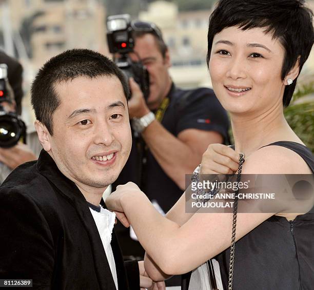 Chinese director Jia Zhang Ke and actress Zhao Tao pose during a photocall for their film '24 City' at the 61st Cannes International Film Festival on...