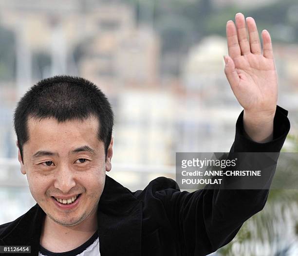 Chinese director Jia Zhang Ke waves as he poses during a photocall for his film '24 City' at the 61st Cannes International Film Festival on May 17,...