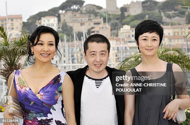 Chinese director Jia Zhang Ke poses with Chinese actresses Joan Chen and Zhao Tao during a photocall for his film '24 City' at the 61st Cannes...