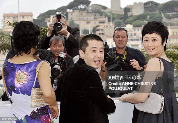 Chinese director Jia Zhang Ke poses with Chinese actresses Joan Chen and Zhao Tao during a photocall for his film '24 City' at the 61st Cannes...