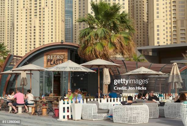 a beachside cafe on the walk at jbr, dubai. - dubai jbr stock pictures, royalty-free photos & images