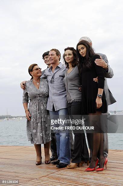Belgian actor Jean-Claude Van Damme poses with his family his mother Eliana Van Varenberg, son Kristopher, wife Gladys Portugues, father Eugene Van...