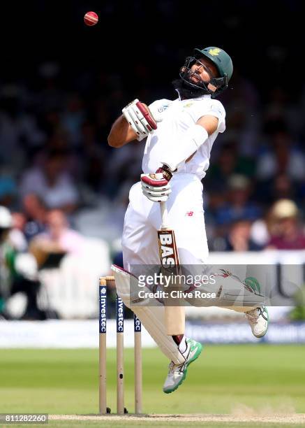 Hashim Amla of South Africa is hit by a bouncer bowled by James Anderson on day four of the 1st Investec Test match between England and South Africa...