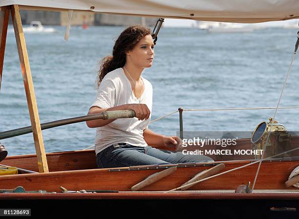 Marie Tabarly, the daughter of French sailing legend late Eric Tabarly, competes aboard her father's monohull 'Pen Duick I' during the opening of...