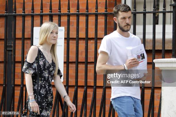 Connie Yates and Chris Gard, parents of terminally-ill 10-month-old Charlie Gard, carry a petition of signatures supporting their case prior to...